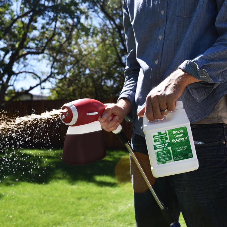 Darker Green Liquid Iron applied with an ortho sprayer to a green lawn