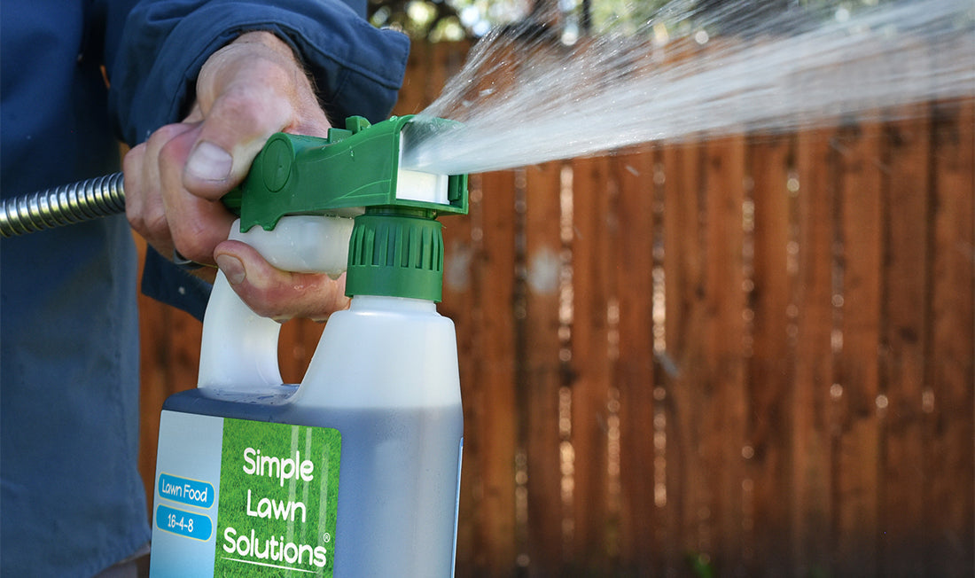 Close-up of Spraying Simple Lawn Solutions Lawn Fertilizer
