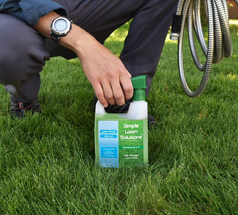 Man holding Simple Lawn Solutions high nitrogen fertilizer