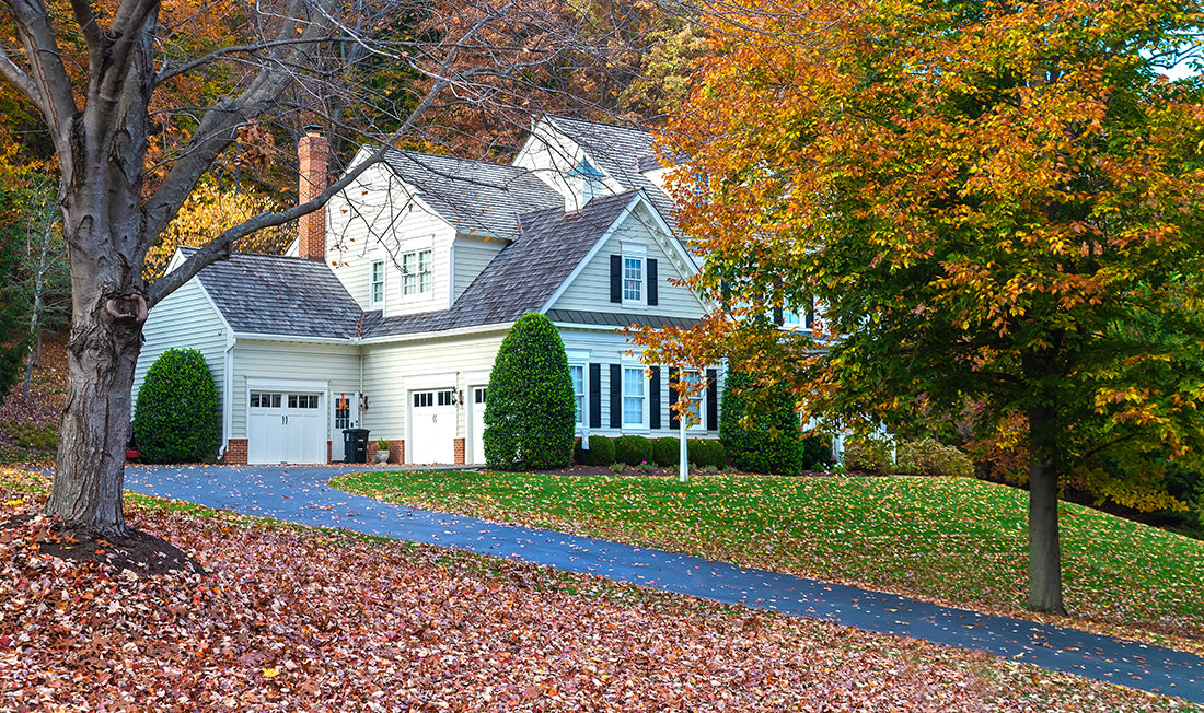 White and gray home on a fall day