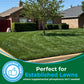 A green, well-maintained residential lawn in front of a brick house, with a tree in the center and a green promotional banner at the bottom that reads &