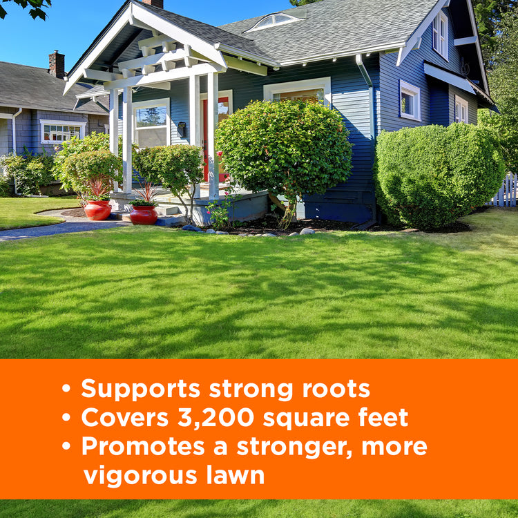 beautiful blue house with a bright green lawn with text on an orange background describing product features, "supports strong roots, covers 3,200 square feet, promotes stronger more vigorous lawn"