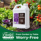 A large white plastic jug of Simple Grow Solutions Sea Rumor Humic Acid Compostable Fertilizer is shown in a garden setting among tomato plants and leafy greens, with an OMRI Listed badge and green banner at the bottom.