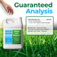 A white plastic jug of Simple Lawn Solutions Lawn Fodder 28-0-0 fertilizer shown on a grassy background with a hand entering from the top left. Large text reads &