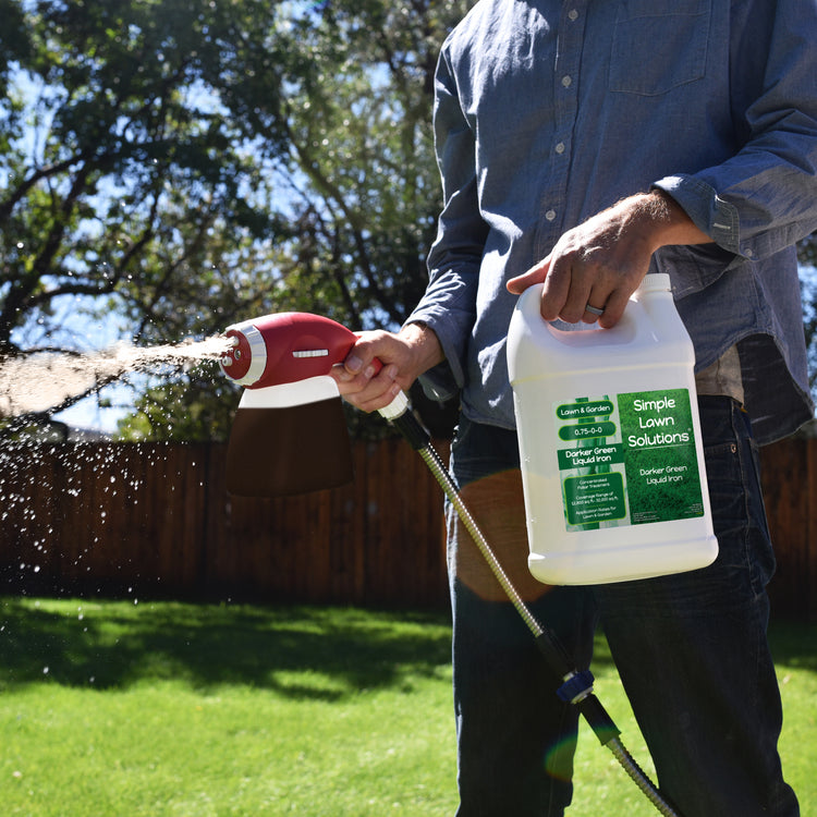 Darker Green Liquid Iron (1 Gallon) being applied with an ortho sprayer